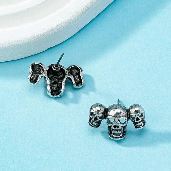Any 2/$20! Antiqued Silver Triple Skull Stud Earrings - Picture 3 of 6